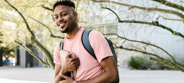 A student holding a book