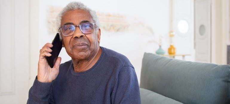 A senior citizen talking to a company that understands the importance of tailoring your services for the senior moving market