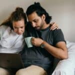 A couple exploring services of a company that utilizes AI tips for moving company Google Profiles