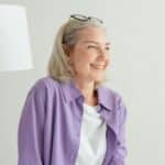 An elderly person smiling after a successful move