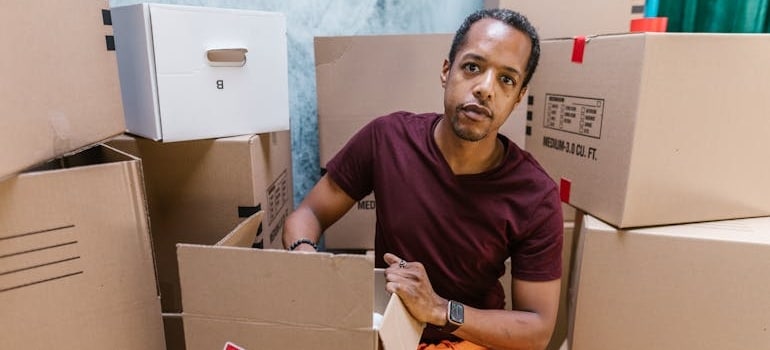 A person moving boxes