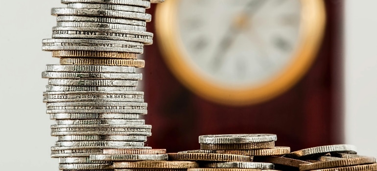 Coins stacked on top of each other, symbolizing the increased costs due to Canada’s digital services tax for movers.