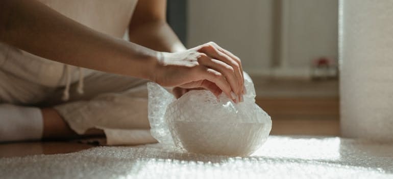 A person packing a bowl in a video