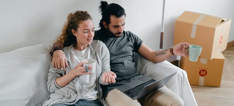 A couple reading an email from a company that uses effective strategies for securing a fluent lead flow