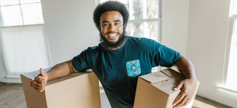 An employee of a moving company holding a box