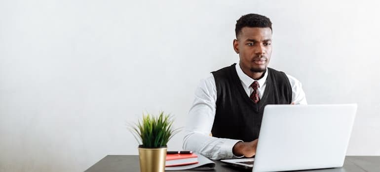 An office administrator using a laptop