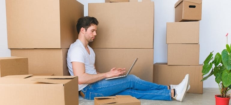 A person using a laptop to look at serives of a moving company that has applied booking form tweaks