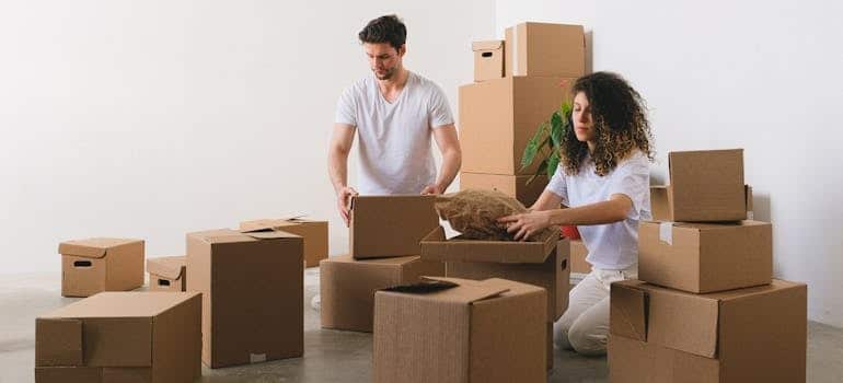 A couple packing boxes