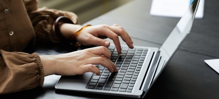 A person doing online research to learn how to control your presence on Google SERPs