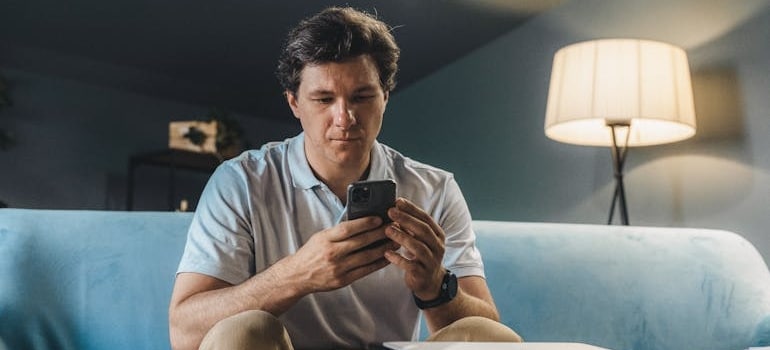 A person searching for moving companies online