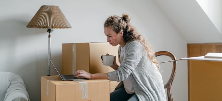 A person checking the website of a moving company