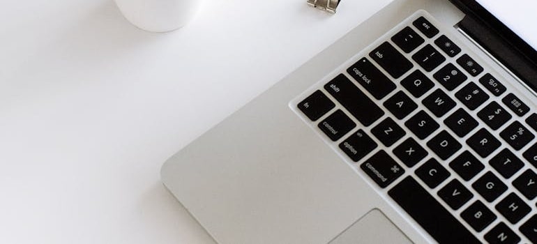 A laptop on a white table