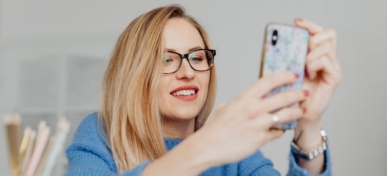 A person using a smartphone to search online