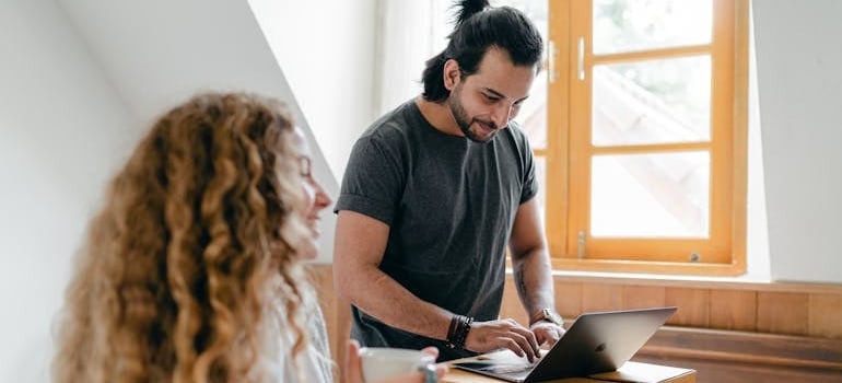 A couple using a laptop to explore services of a company that applies the rigth strategies for using landing pages for lead generation
