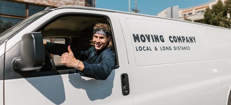 An employee of a moving company in a van