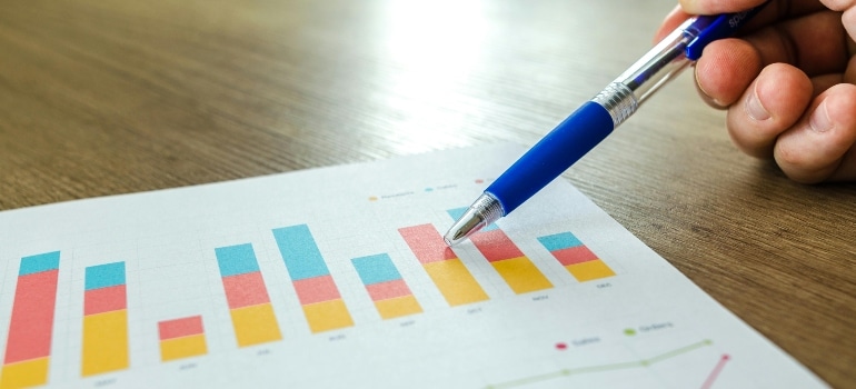 A close-up of a paper with graphs, explaining why Google ranks older moving companies higher.