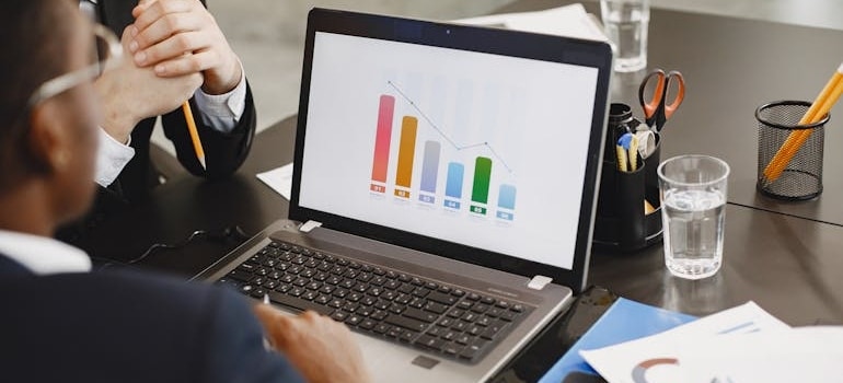 A manager of a company looking at the graphs of SEO metrics Google uses