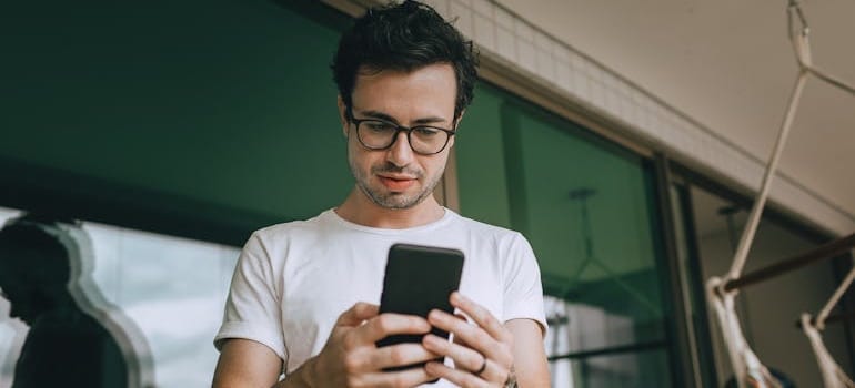 A person using a smartphone to leave a review after a move