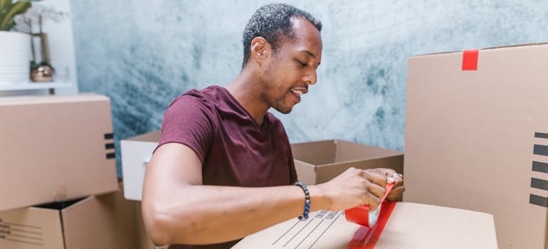 A person packing boxes and getting ready for a move