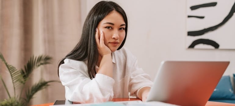 A business manager using a laptop to learn what Google knows about your moving company