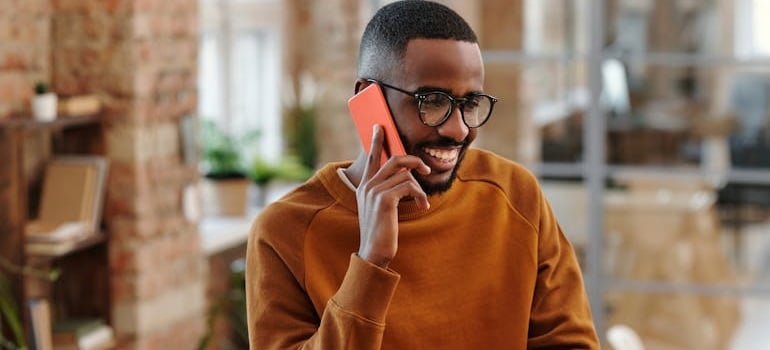 A person calling a moving company to ask for pricing