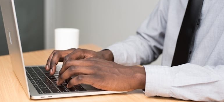 A business manager doing research on what AI says about your moving company