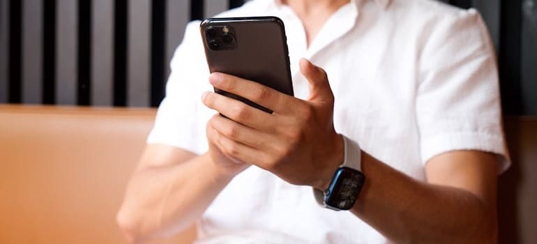 A person using a smartphone to read a message